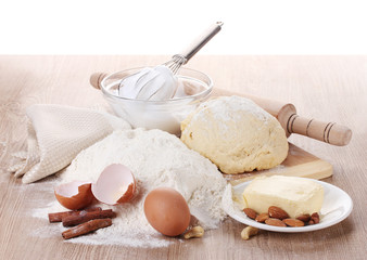 Ingredients for the dough wooden table on white background