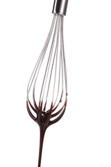 Metal whisk for whipping eggs with chocolate cream isolated