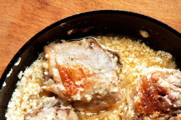 fatty meat fried in a skillet