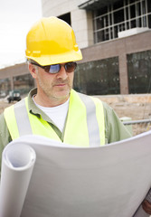 Construction Foreman looking at Blueprints
