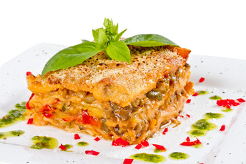Closeup of lasagna and basil fork