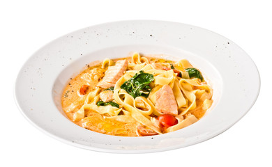 tasty pasta with cream, salmon, cheese and parsley close up
