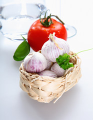 A basket with Tomato and garlic