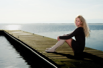 Pretty young female on jetty