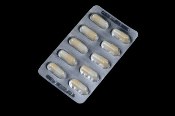 Two color capsule on isolated black background