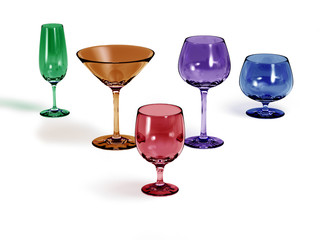 Five different colored glasses with a white background