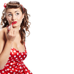 Pin-up  woman applying her make-up