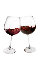Two glasses of red wine toasting on white background