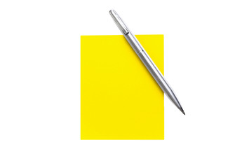 Yellow note paper and elegant metal pen