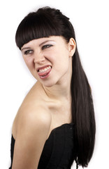 Naklejka premium Portrait of expressive woman with her tongue out