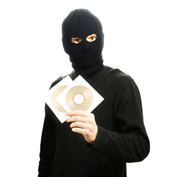 Bandit in black mask with CD disks isolated on white