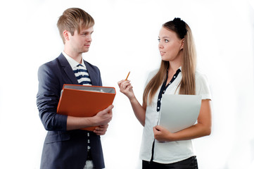 Beautiful young woman explaining something to young man holding