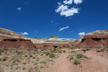 Coloured layered  sanstone form hills in Utah desert