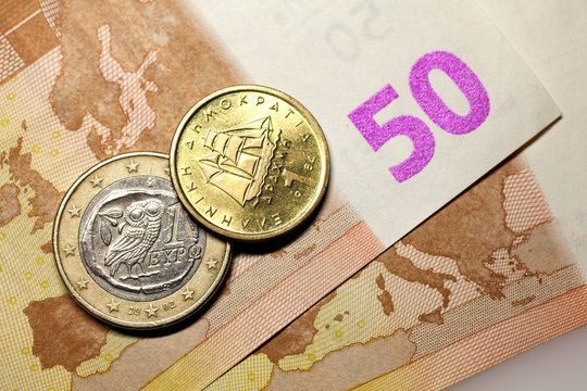 50 euros, one euro coin and one drachma coin