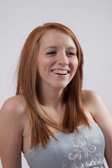 redhead woman smiling at the camera