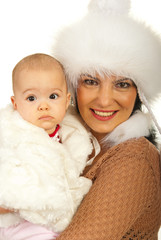 Mother and baby girl in fur clothes