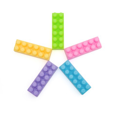 5 toy bricks on white