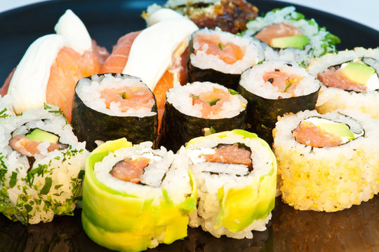 Sushi set in a black plate close up