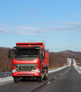 The Red Truck On A Winter Road.