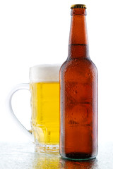 Beer mug and bottle isolated on white background