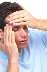 Young man having a headache.