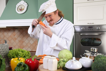 Young chef preparing lunch in kitchen