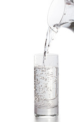 Water pouring into glass Isolated on white