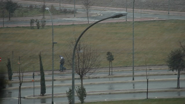 Men walking under the snow