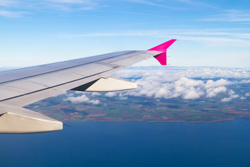 Obraz premium Aerial view of Ireland with plane wing