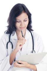 Young female doctor holding a clipboard