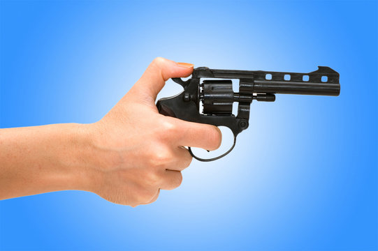 Hand holding revolver isolated on the white