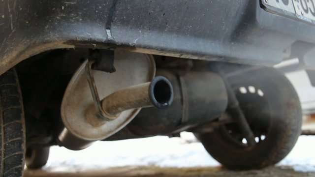 car exhaust dripping and blowing vapour