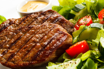 Grilled steaks and vegetables