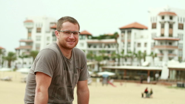 Happy man looking to camera and smiling