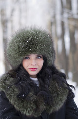 portrait of a young beautiful woman in winter clothes