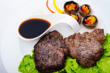 Well done steak served in the plate