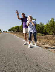 Fototapeta premium senior hitchhikers begging for assistance