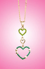 Golden jewellery against gradient background