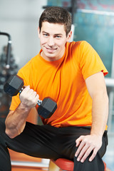 bodybuilder man doing biceps muscle exercises