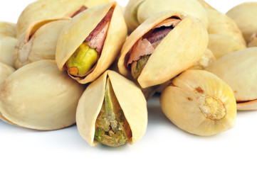 salted pistachio nuts on white background