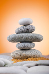 Balanced pebbles with colour background