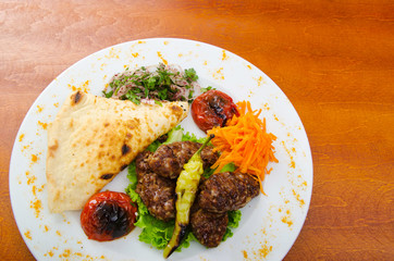 Meat cuisine - kebab served in plate
