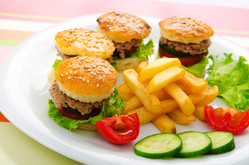 Plate with tasty mini burgers