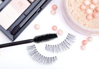 black false eyelashes with mascara and powder