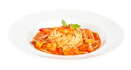 A plate of linguini with sauteed shrimp, tomato, chili  and oliv