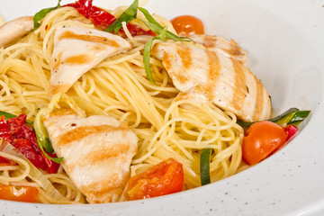 close-up of plate of pasta and chicken