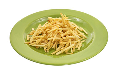 Shoestring potatoes on green plate
