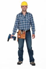 Construction worker holding a drill.