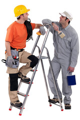 Electrician stood with painter