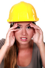 Construction worker with a headache